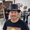 Smiling man with a hat indoors