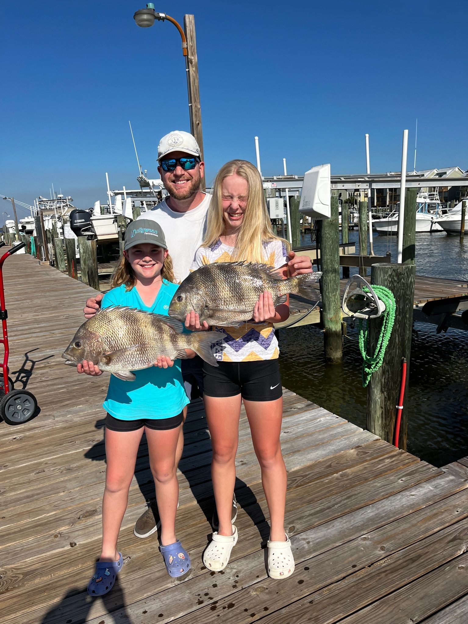 Smiling group displaying their catch
