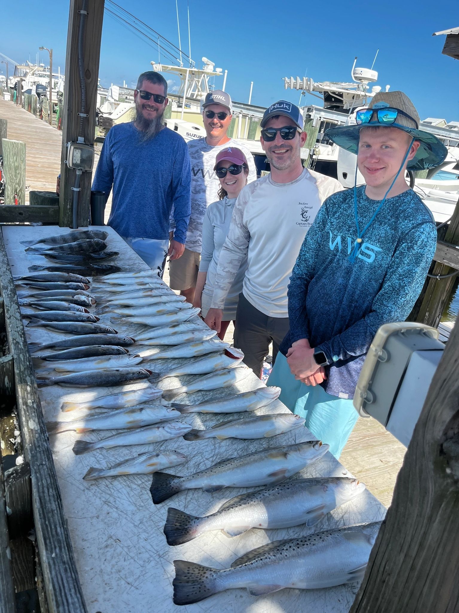 Smiling anglers with their catch